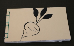 beet.  The dark blue beet is a stencil cut from thin paper and silkscreened onto the front and back of this book.