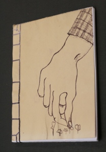 Thinning brassicas.  This image came out of a lot of sketching I've been doing for my printmaking class.  I've been thinking about hands, work, and the many tasks hands perform.  Modified simple Japanese stab binding.  Winter 2009.